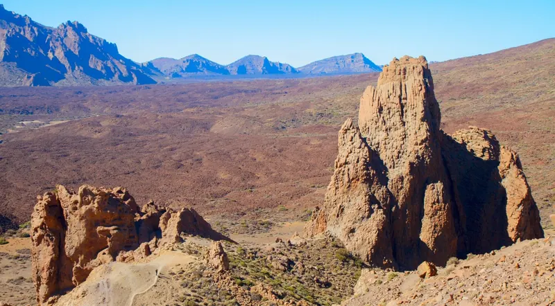 Rock towers above the Llano de Ucanca plain with the caldera wall beyond